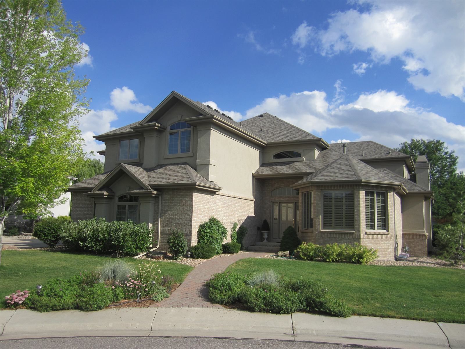 Completed asphalt shingle roof replacement by Bailey Roofing on a two-story Front Range home