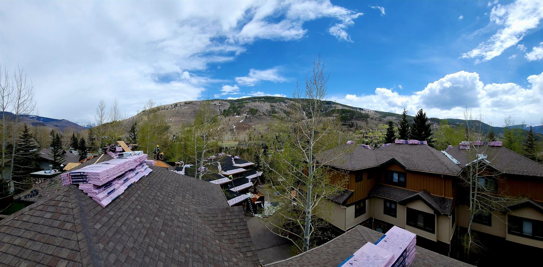 Bailey Roofing crews reroofing the Chateau Tremonte condominium complex in Vail with Owens Corning Duration Storm shingles staged, May 2023