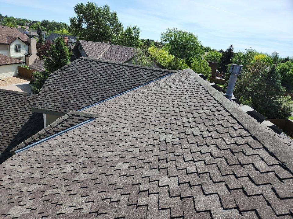 Aerial view of a finished designer shingle roof by Bailey Roofing on East Powers Drive, Piney Creek, Centennial, June 2023