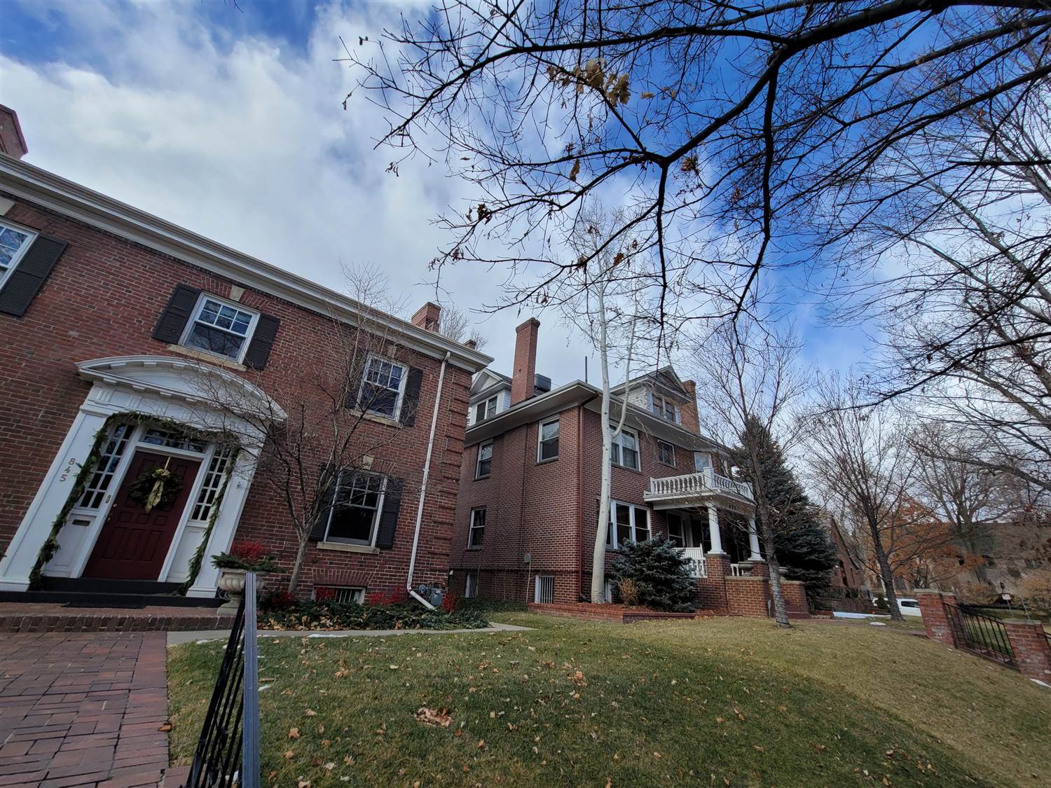 Brick two-story with failing shake siding documented by Bailey Roofing before restoration near the Denver Botanic Gardens, January 2021