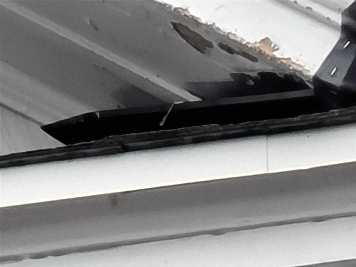 Rotted trim and failing flashing found during Bailey Roofing's siding inspection near the Denver Botanic Gardens, January 2021