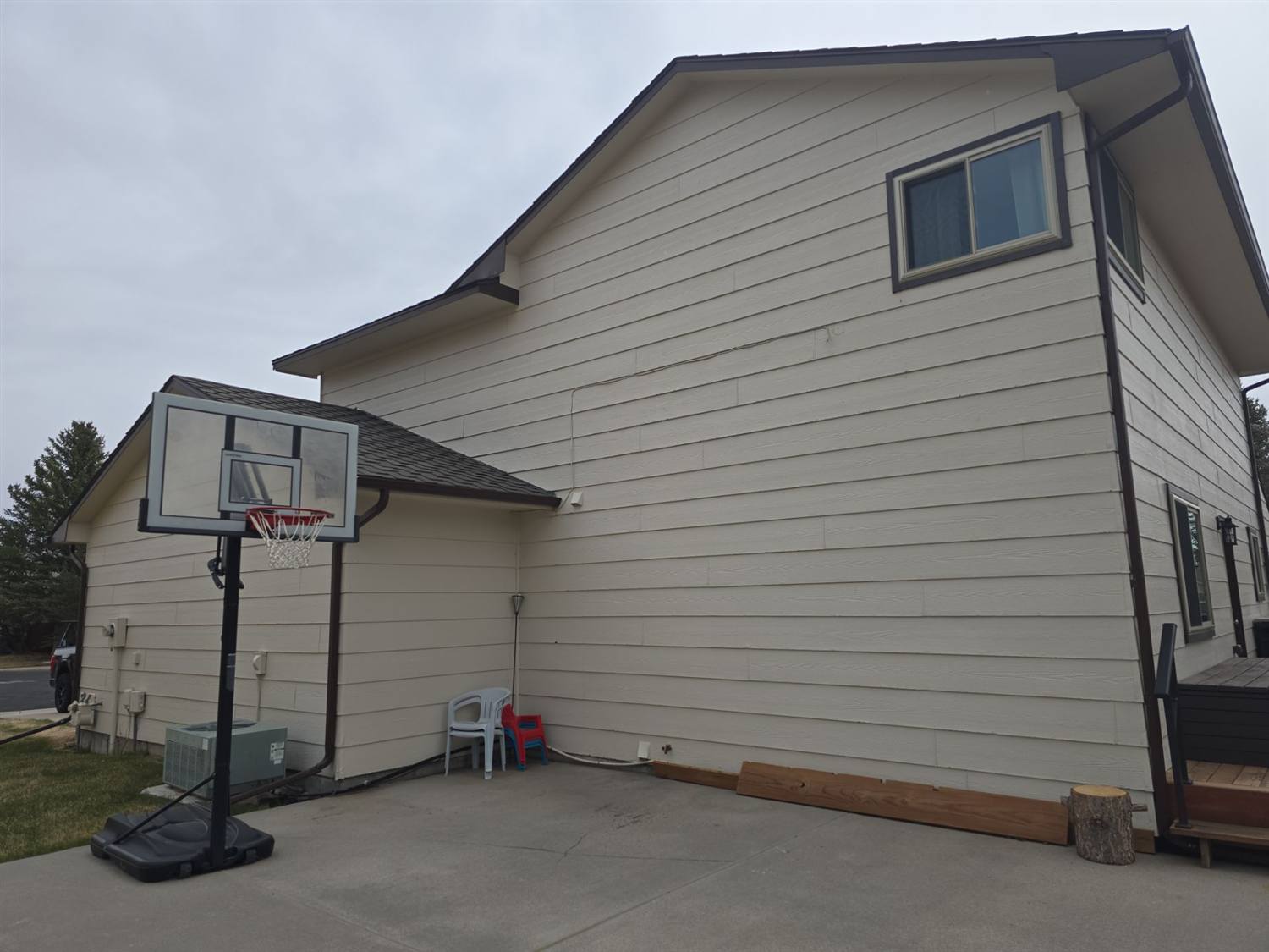 Aging lap siding documented by Bailey Roofing before a full siding replacement in Cheyenne, Wyoming, April 2026