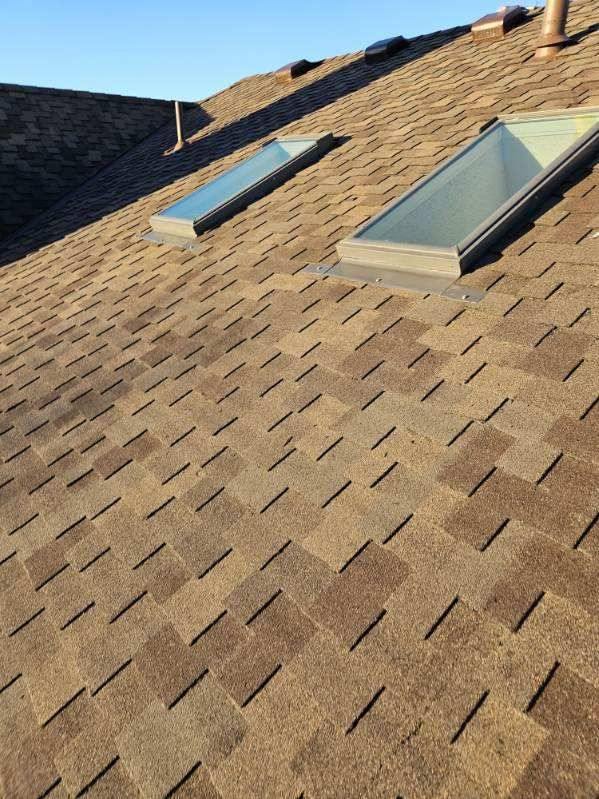 Two new flush skylights installed by Bailey Roofing in a CertainTeed Presidential roof on East Powers Drive in Piney Creek, Centennial, March 2024