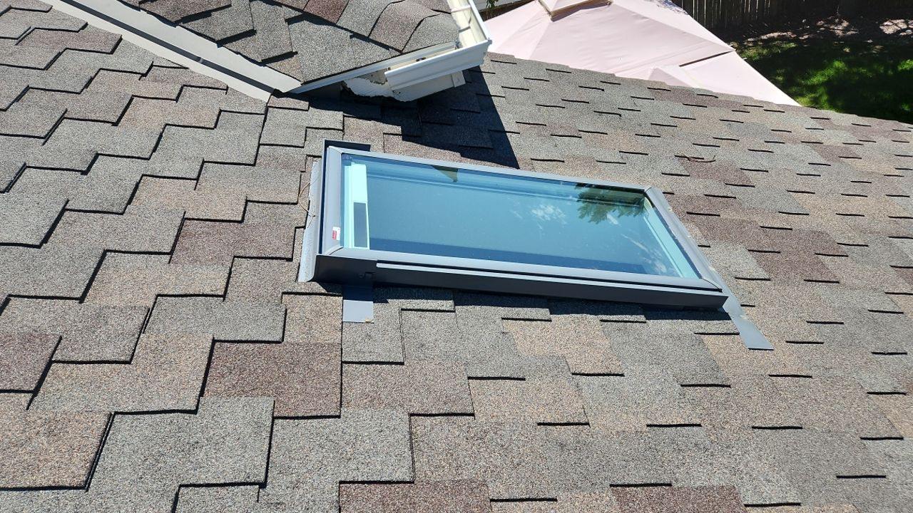 Aging skylight on a hail-damaged roof documented by Bailey Roofing before replacement in Centennial, June 2023